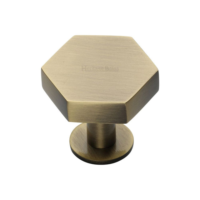 This is an image of a Heritage Brass - Cabinet Knob Hexagon Design with Rose 32mm Antique Brass Finish, c4345-32-at that is available to order from Trade Door Handles in Kendal.