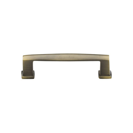 This is an image of a Heritage Brass - Cabinet Pull Vintage Design 102mm CTC Antique Brass Finish, c4384-102-at that is available to order from Trade Door Handles in Kendal.