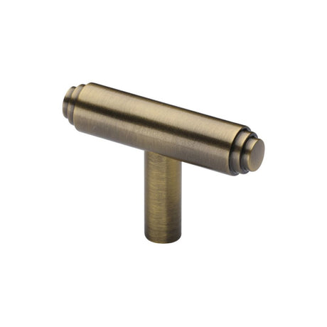 This is an image of a Heritage Brass - Cabinet Knob Stepped T-Bar Design 45mm Antique Brass Finish, c4445-at that is available to order from Trade Door Handles in Kendal.