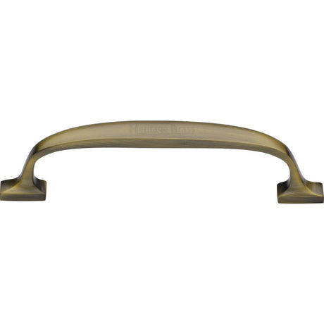 This is an image of a Heritage Brass - Cabinet Pull Durham Design 128mm CTC Antique Brass Finish, c7213-128-at that is available to order from Trade Door Handles in Kendal.