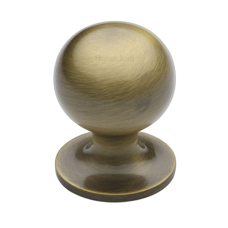 This is an image of a Heritage Brass - Cabinet Knob Ball Design 32mm Antique Brass Finish, c8321-32-at that is available to order from Trade Door Handles in Kendal.