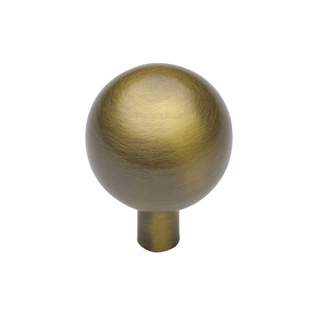 This is an image of a Heritage Brass - Cabinet Knob Sphere Design 22mm Antique Brass Finish, c8323-22-at that is available to order from Trade Door Handles in Kendal.