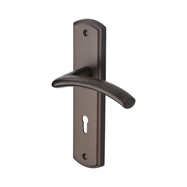 This is an image of a Heritage Brass - Door Handle Lever Lock Centaur Design Matt Bronze Finish, cen1000-mb that is available to order from Trade Door Handles in Kendal.