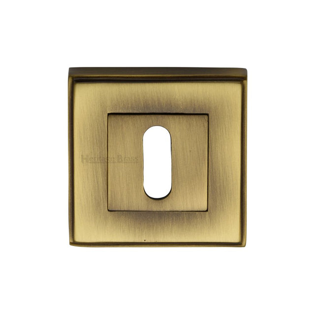 This is an image of a Heritage Brass - Key Escutcheon Square Antique Brass Finish, dec7000-at that is available to order from Trade Door Handles in Kendal.