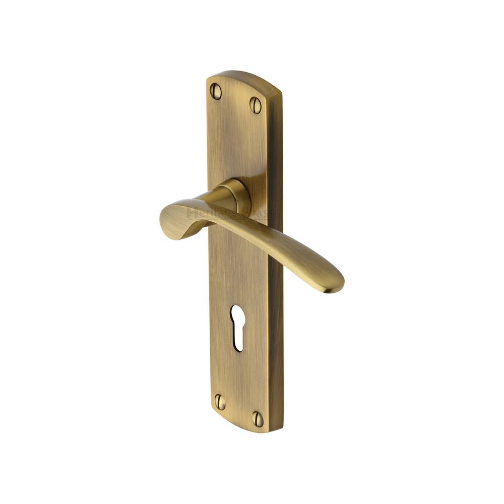 This is an image of a Heritage Brass - Door Handle Lever Lock Diplomat Design Antique Brass Finish, dip7800-at that is available to order from Trade Door Handles in Kendal.