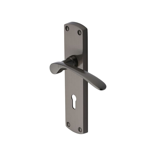 This is an image of a Heritage Brass - Door Handle Lever Lock Diplomat Design Matt Bronze Finish, dip7800-mb that is available to order from Trade Door Handles in Kendal.