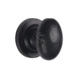 This is an image of a M.Marcus - Black Iron Rustic Cabinet Knob on Round Plate Oval Design 32mm, fb179-32 that is available to order from Trade Door Handles in Kendal.