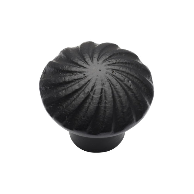 This is an image of a M.Marcus - Black Iron Rustic Cabinet Knob Wheel Design 32mm, fb3891-32 that is available to order from Trade Door Handles in Kendal.