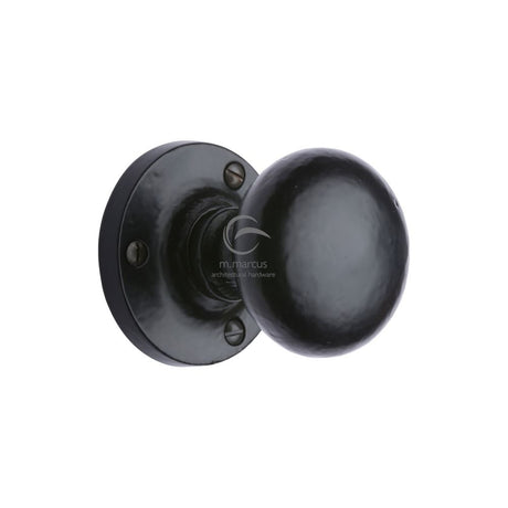 This is an image of a M.Marcus - Black Iron Rustic Mortice Knob on Rose Alveley Design, fb4975 that is available to order from Trade Door Handles in Kendal.
