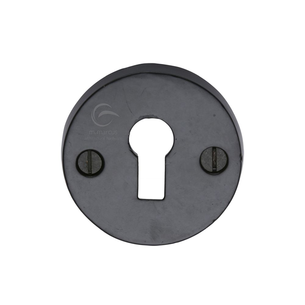 This is an image of a M.Marcus - Black Iron Rustic Key Escutcheon, fb553 that is available to order from Trade Door Handles in Kendal.