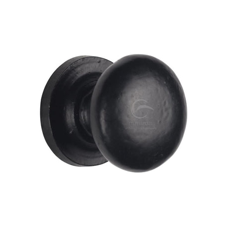 This is an image of a M.Marcus - Black Iron Rustic Cabinet Knob on Round Plate Round Design 38mm, fb613-38 that is available to order from Trade Door Handles in Kendal.