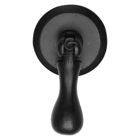This is an image of a M.Marcus - Matt Black Rustic Iron Cabinet Drop Pull On Round Plate, fb6264 that is available to order from Trade Door Handles in Kendal.