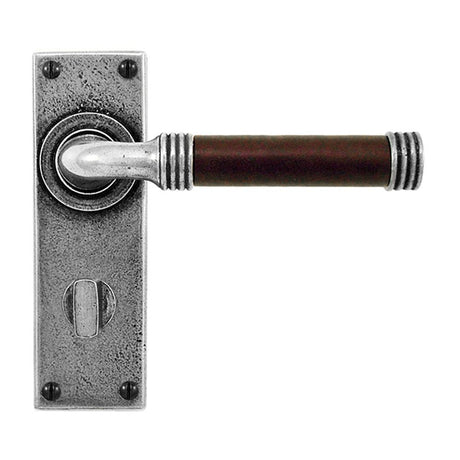 This is an image showing Finesse - Jarrow Pewter and Chocolate Leather Door Handle on Backplate - Bathroo available from trade door handles, quick delivery and discounted prices
