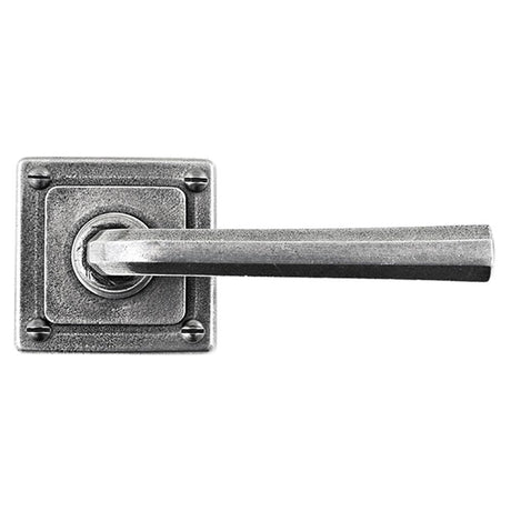 This is an image showing Finesse - Tunstall Pewter Door Handle on Square Rose available from trade door handles, quick delivery and discounted prices