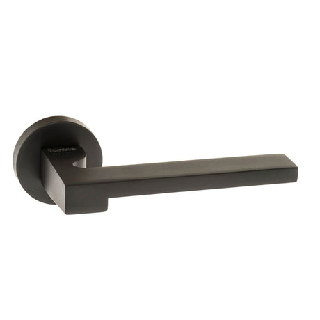 This is an image of Forme Ginevra Designer Lever on Minimal Round Rose - Matt Black available to order from Trade Door Handles.