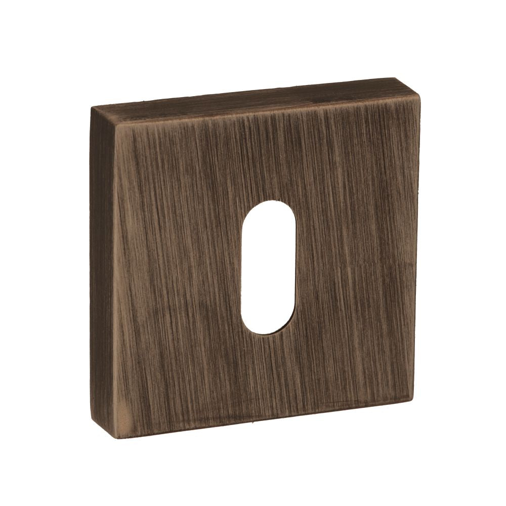 This is an image of Forme Key Escutcheon on Minimal Square Rose - Urban Bronze available to order from Trade Door Handles.