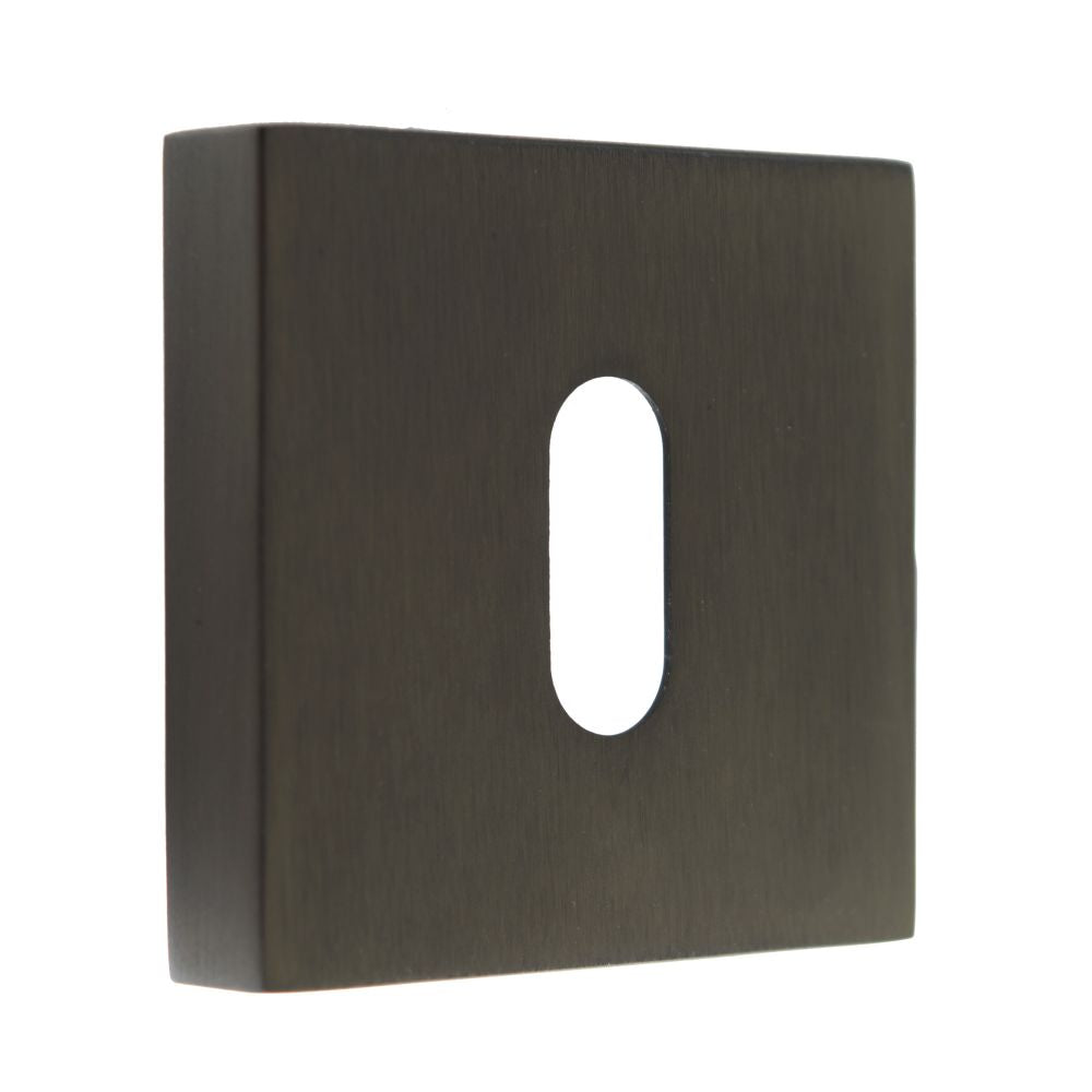 This is an image of Forme Key Escutcheon on Minimal Square Rose - Urban Dark Bronze available to order from Trade Door Handles.