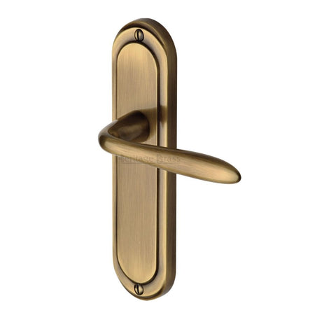 This is an image of a Heritage Brass - Door Handle Lever Latch Henley Design Antique Brass Finish, hen1210-at that is available to order from Trade Door Handles in Kendal.