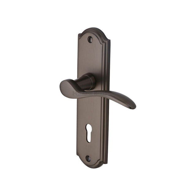 This is an image of a Heritage Brass - Door Handle Lever Lock Howard Design Matt Bronze Finish, how1300-mb that is available to order from Trade Door Handles in Kendal.