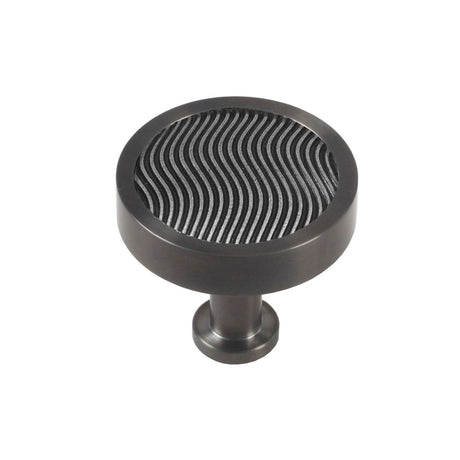This is an image showing Finesse Immix Spiral Cupboard Knob - Pewter/Graphite available from trade door handles, quick delivery and discounted prices.
