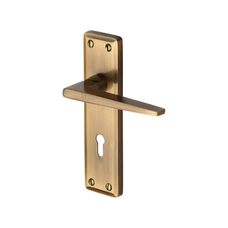 This is an image of a Heritage Brass - Door Handle Lever Lock Kendal Design Antique Brass Finish, ken6800-at that is available to order from Trade Door Handles in Kendal.