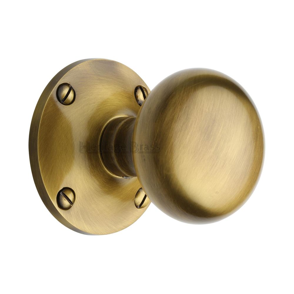 This is an image of a Heritage Brass - Mortice Knob on Rose Kensington Design Antique Brass Finish, ken980-at that is available to order from Trade Door Handles in Kendal.