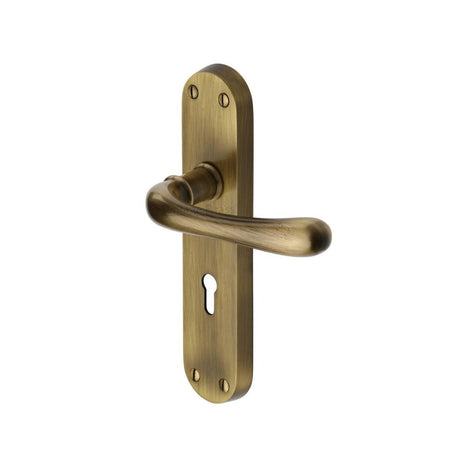 This is an image of a Heritage Brass - Door Handle Lever Lock Luna Design Antique Brass Finish, lun5300-at that is available to order from Trade Door Handles in Kendal.