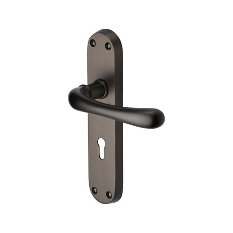 This is an image of a Heritage Brass - Door Handle Lever Lock Luna Design Matt Bronze Finish, lun5300-mb that is available to order from Trade Door Handles in Kendal.