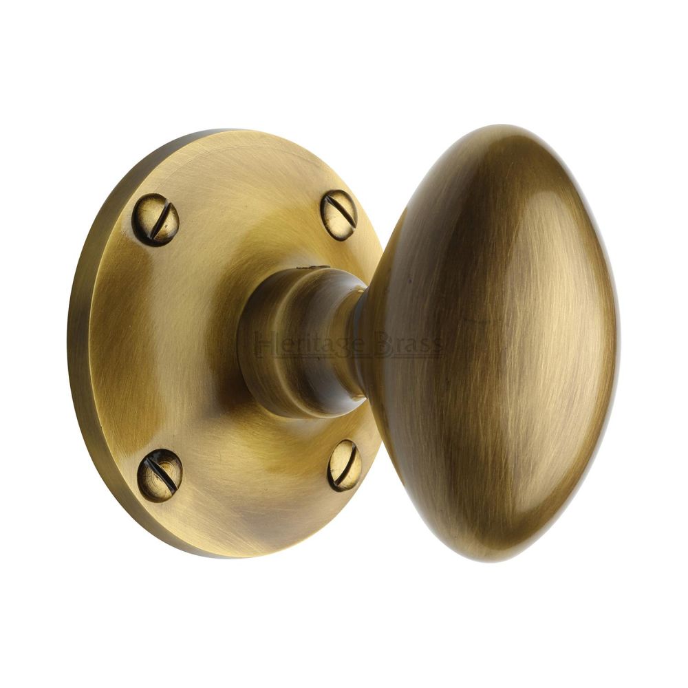 This is an image of a Heritage Brass - Mortice Knob on Rose Mayfair Design Antique Brass Finish, may960-at that is available to order from Trade Door Handles in Kendal.