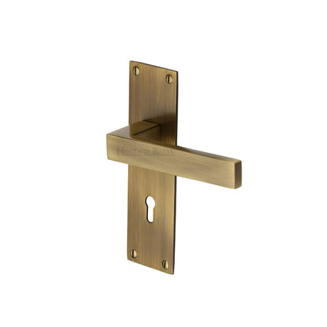 This is an image of a Heritage Brass - Door Handle Lever Lock Metro Design Antique Brass Finish, met4900-at that is available to order from Trade Door Handles in Kendal.