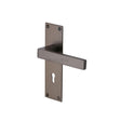 This is an image of a Heritage Brass - Door Handle Lever Lock Metro Design Matt Bronze Finish, met4900-mb that is available to order from Trade Door Handles in Kendal.