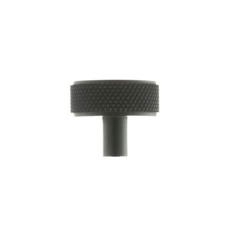 This is an image of Millhouse Brass Hargreaves Disc Knurled Cabinet Knob Concealed Fix - Matt Black available to order from Trade Door Handles.