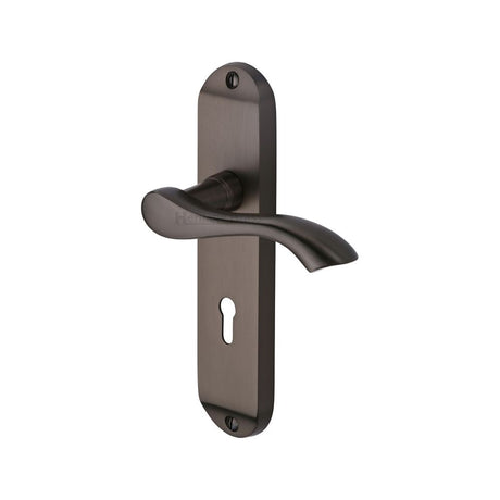 This is an image of a Heritage Brass - Door Handle Lever Lock Algarve Design Matt Bronze Finish, mm924-mb that is available to order from Trade Door Handles in Kendal.