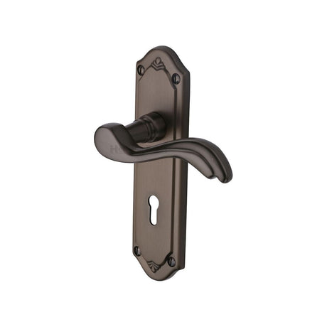 This is an image of a Heritage Brass - Door Handle Lever Lock Lisboa Design Matt Bronze Finish, mm991-mb that is available to order from Trade Door Handles in Kendal.