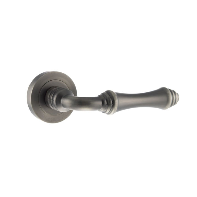 This is an image of Old English Durham Lever on Round Rose - Matt Gun Metal available to order from Trade Door Handles.