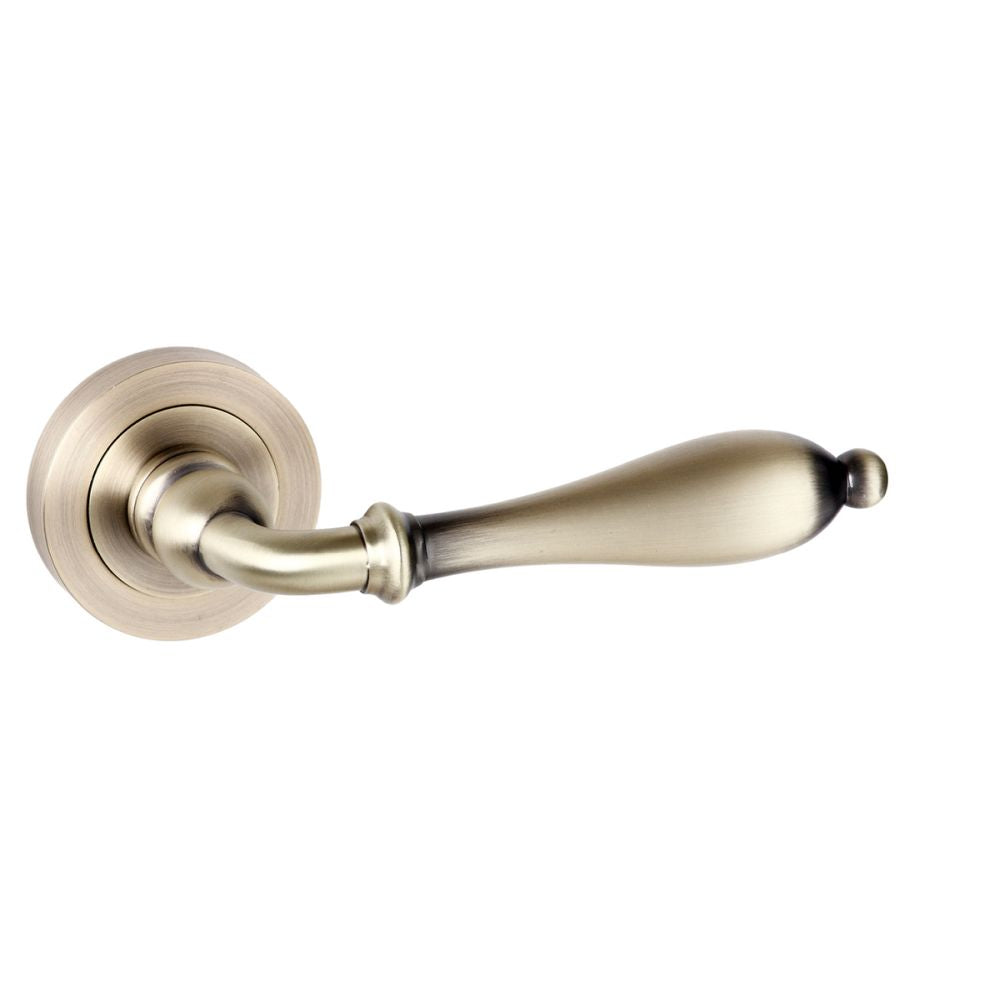High quality image of Old English Wrexham Lever on Round Rose - Matt Antique Brass | Sku. oe142mab | available to order from Trade Door Handles in Kendal.
