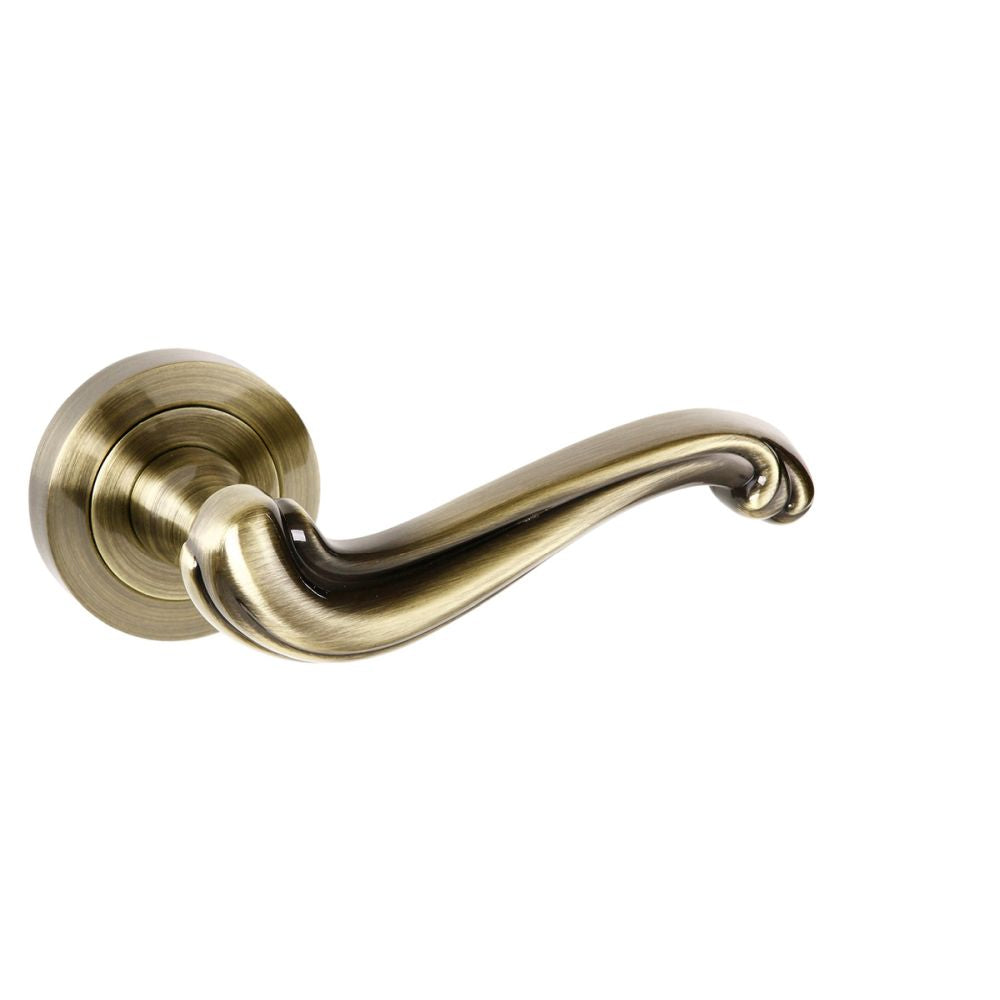 High quality image of Old English Colchester Lever on Round Rose - Antique Brass | Sku. oe177ab | available to order from Trade Door Handles in Kendal.