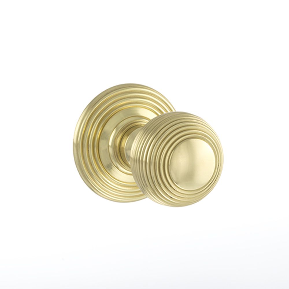 This is an image of Old English Ripon Solid Brass Reeded Mortice Knob on Concealed Fix Rose - Polish available to order from Trade Door Handles.