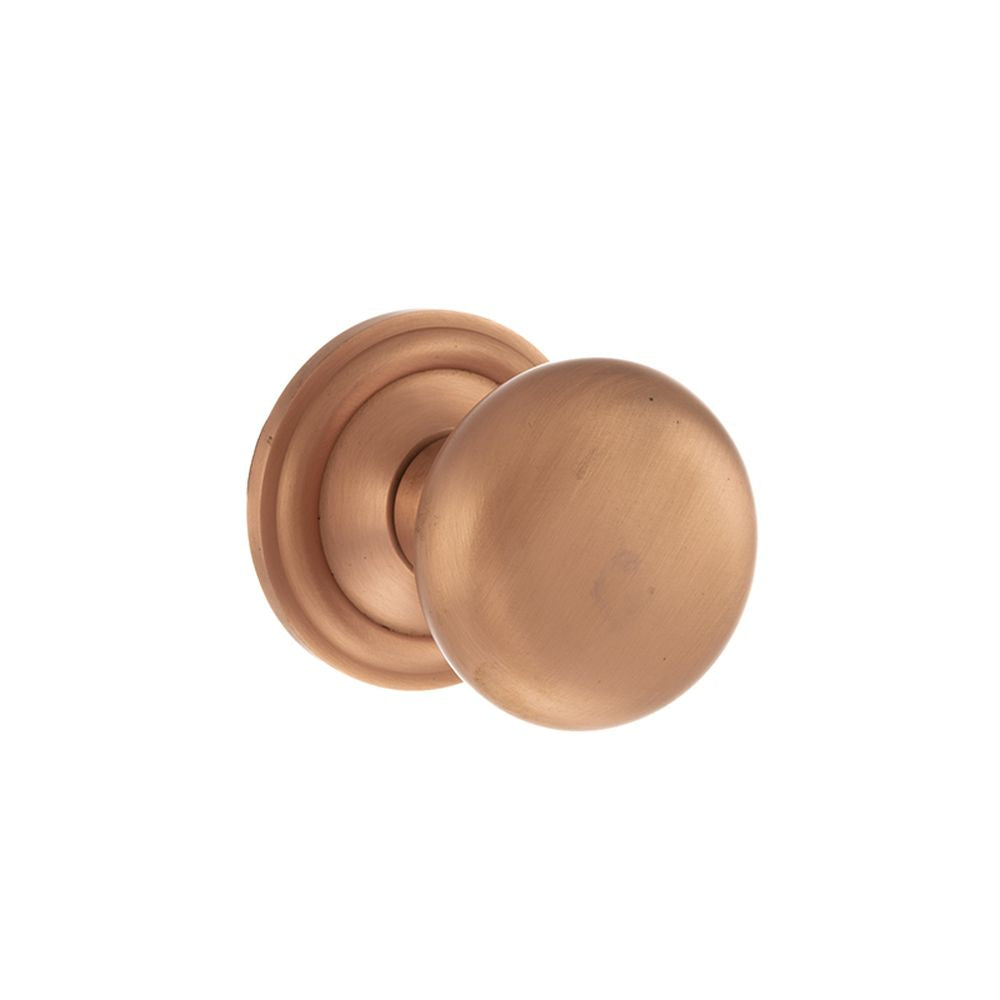 This is an image of Old English Harrogate Solid Brass Mushroom Mortice Knob on Concealed Fix Rose - available to order from Trade Door Handles.