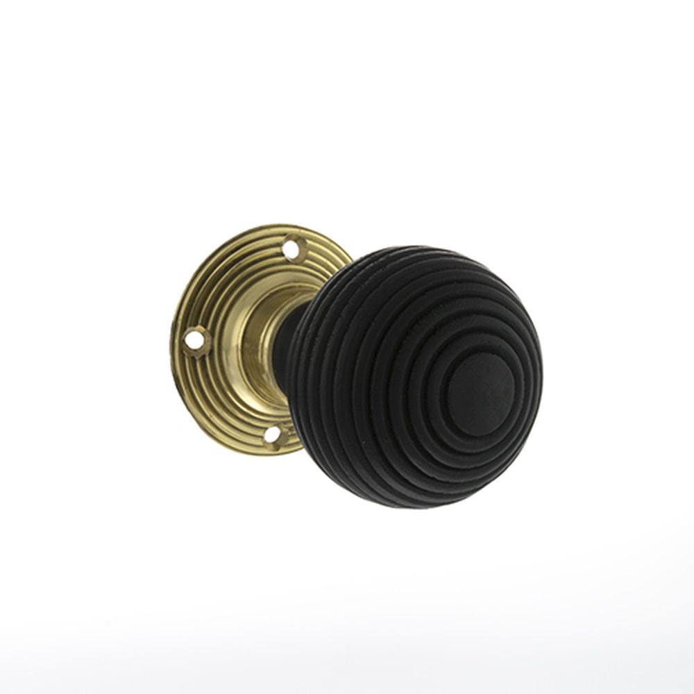 This is an image of Old English Whitby Ebony Wood Reeded Mortice Knob on 60mm Face Fix Rose - Polish available to order from Trade Door Handles.