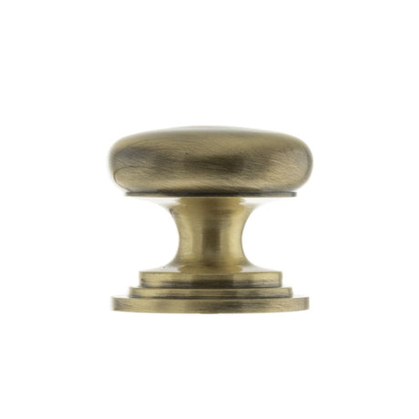 This is an image of Old English Lincoln Solid Brass Cabinet Knob 38mm Concealed Fix - Ant. Brass available to order from Trade Door Handles.