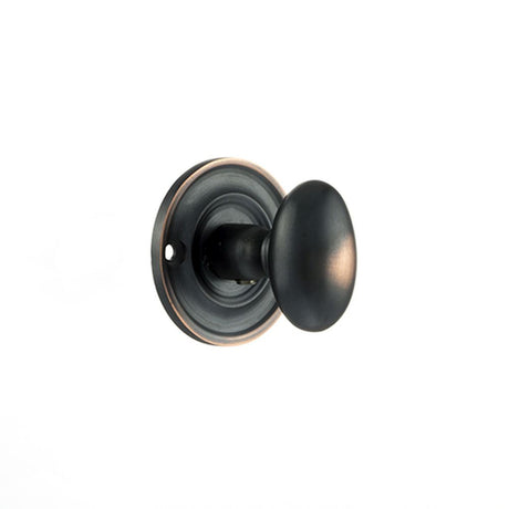 This is an image of Old English Solid Brass Oval WC Turn and Release - Antique Copper available to order from Trade Door Handles.