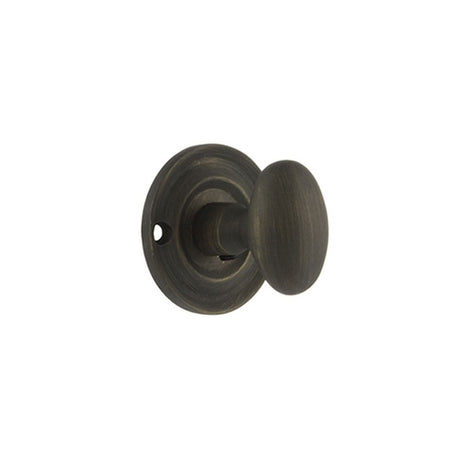 This is an image of Old English Solid Brass Oval WC Turn and Release - Urban Bronze available to order from Trade Door Handles.