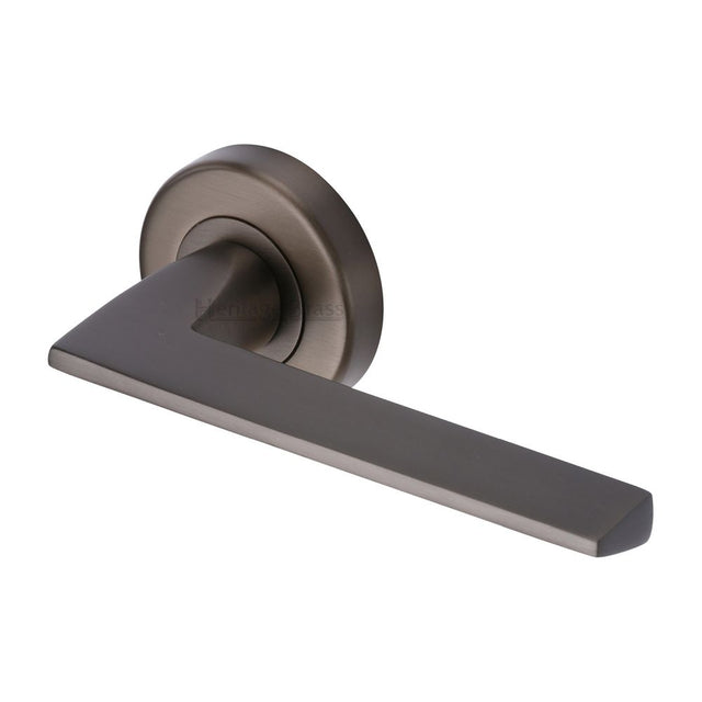 This is an image of a Heritage Brass - Door Handle Lever Latch on Round Rose Pyramid Design Matt Bronz, pyd3535-mb that is available to order from Trade Door Handles in Kendal.