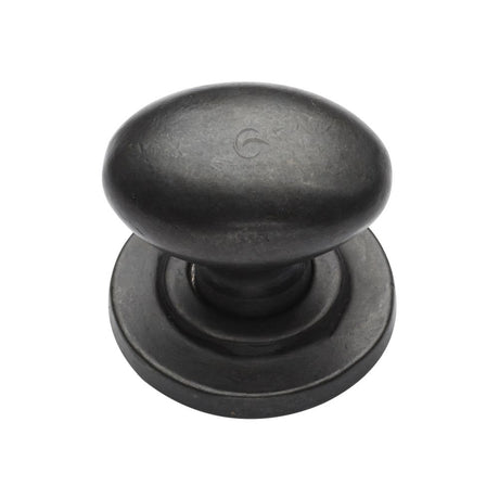 This is an image of a M.Marcus - Rustic Dark Bronze Cabinet Knob Oval Design on Rose 32mm, rdb179-32 that is available to order from Trade Door Handles in Kendal.