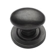 This is an image of a M.Marcus - Rustic Dark Bronze Cabinet Knob Oval Design on Rose 38mm, rdb179-38 that is available to order from Trade Door Handles in Kendal.