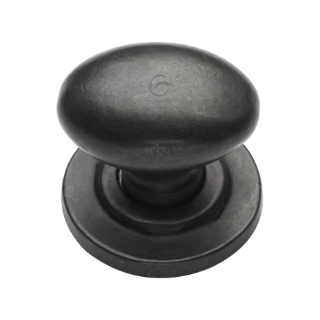 This is an image of a M.Marcus - Rustic Dark Bronze Cabinet Knob Oval Design on Rose 38mm, rdb179-38 that is available to order from Trade Door Handles in Kendal.