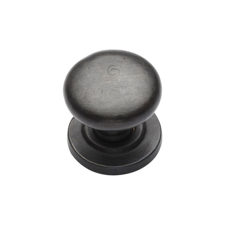 This is an image of a M.Marcus - Rustic Dark Bronze Cabinet Knob Round Design on Rose 25mm, rdb613-25 that is available to order from Trade Door Handles in Kendal.