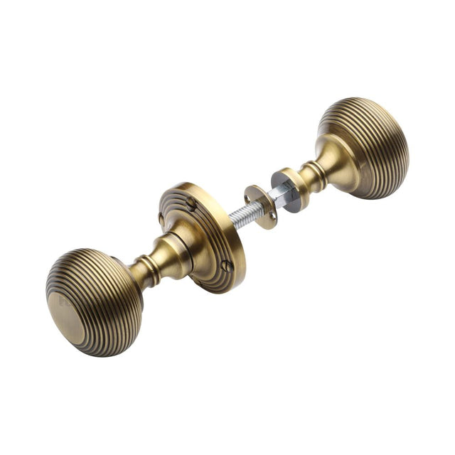 This is an image of a Heritage Brass - Reeded Rim Knob Antique Brass Finish, rim-v971-at that is available to order from Trade Door Handles in Kendal.