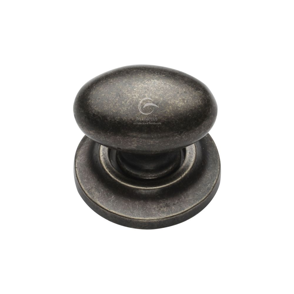 This is an image of a M.Marcus - Rustic Pewter Cabinet Knob Oval Design on Rose 38mm, rpw179-38 that is available to order from Trade Door Handles in Kendal.